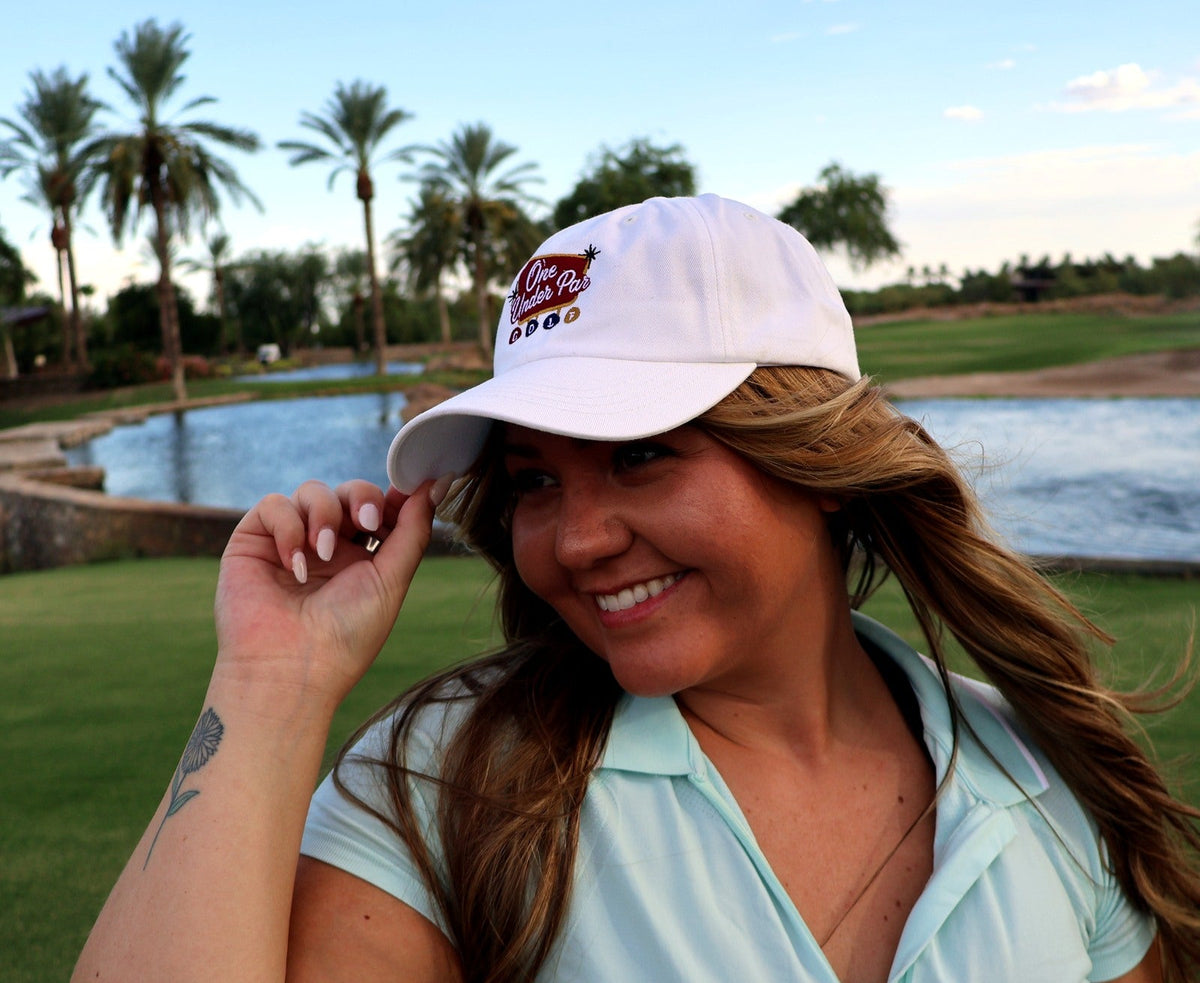 Woman wearing the white Vegas Style embroidered golf hat at Vistancia Golf Club
