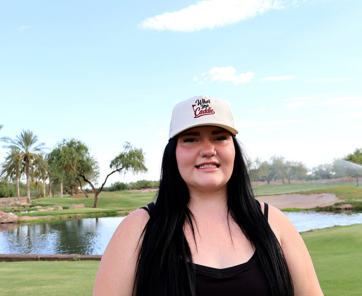 Woman wearing the ivory Who’s Your Caddie performance rope hat on the golf course