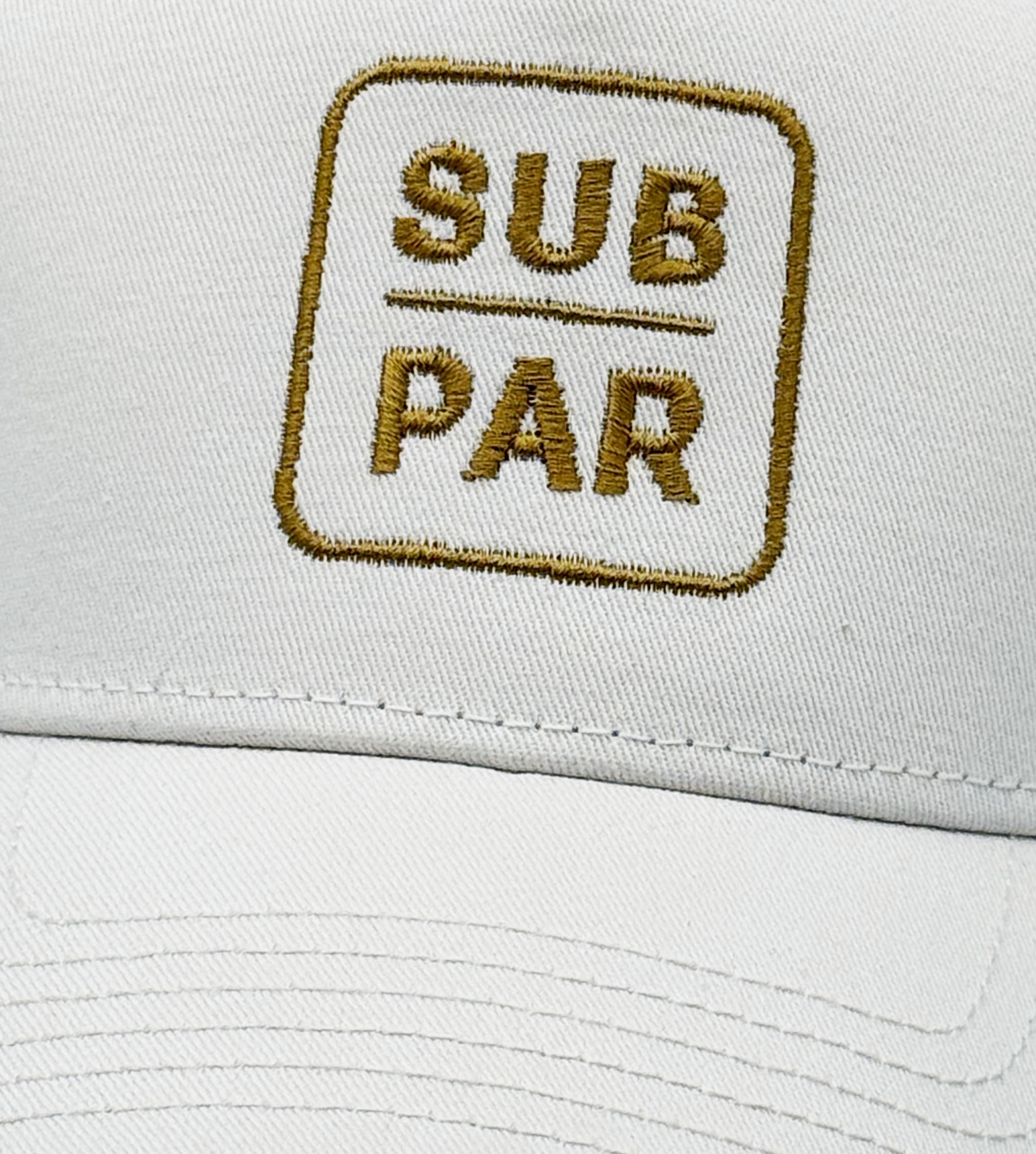 Sub Par old-gold embroidery on ecru golf hat