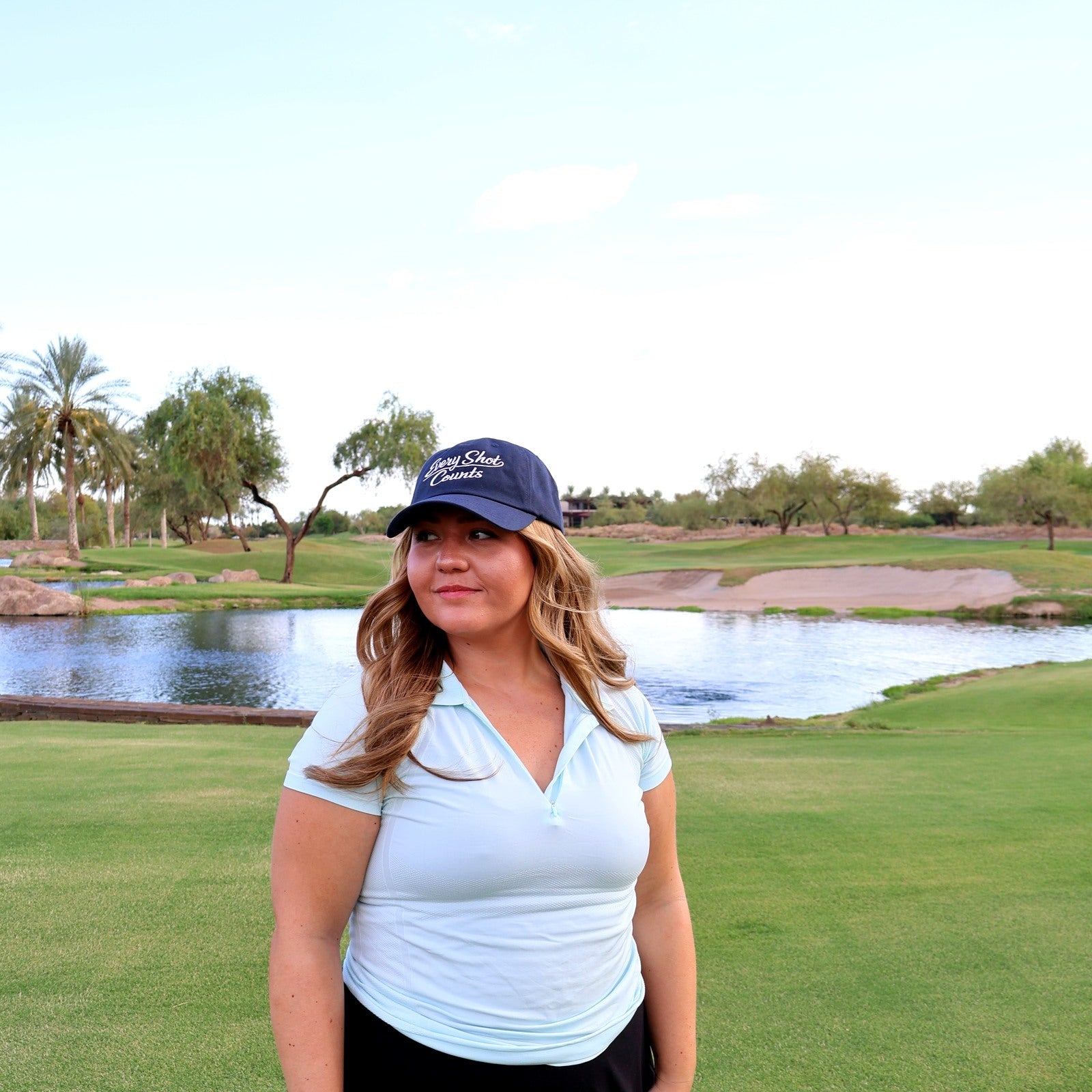 Golfer wearing the navy Every Shot Counts hat on the course at Vistancia