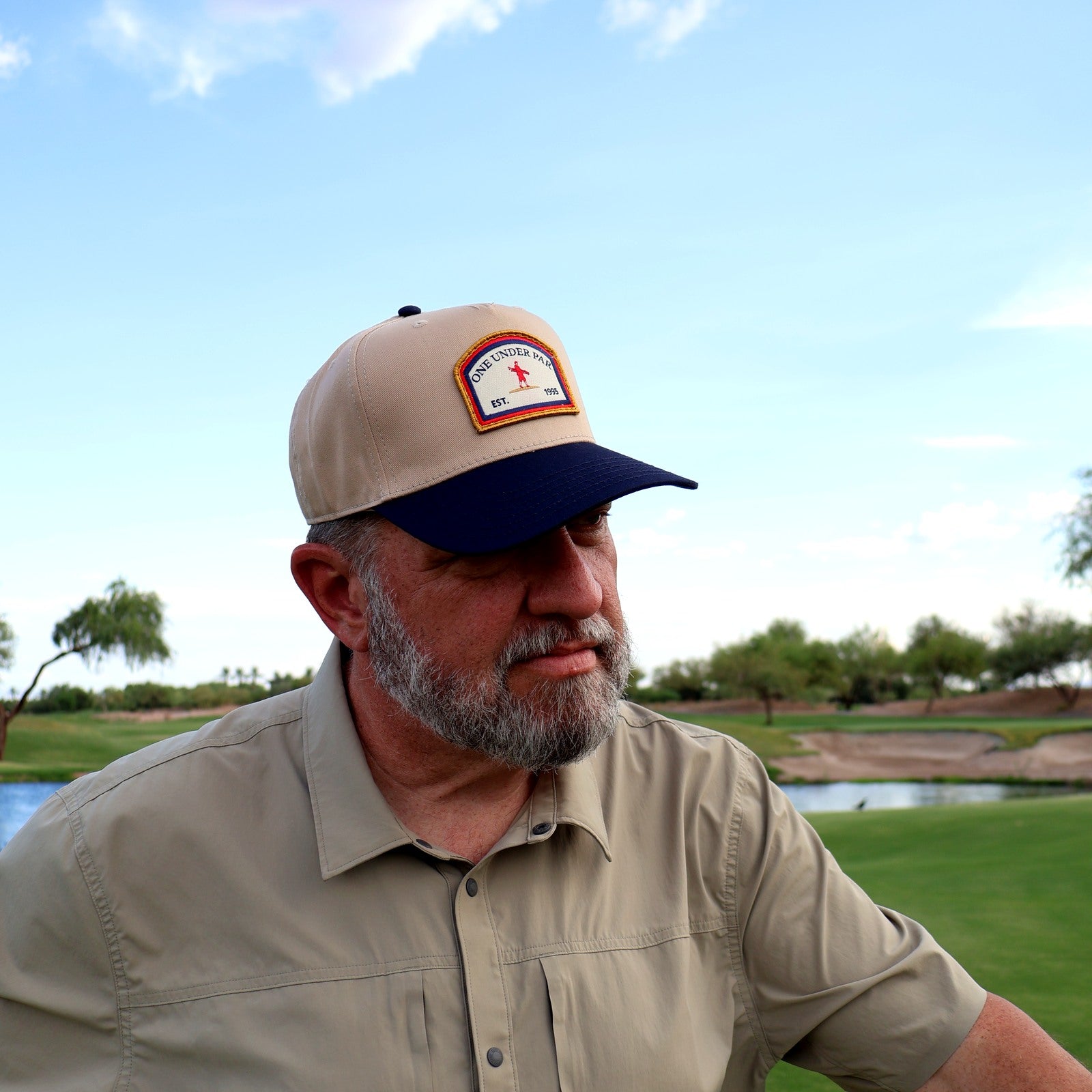 Golfer wearing the One Under Vintage two-tone patch hat at Vistancia Golf Club