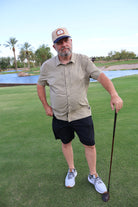 Golfer wearing the One Under Vintage two-tone patch hat at Vistancia Golf Club
