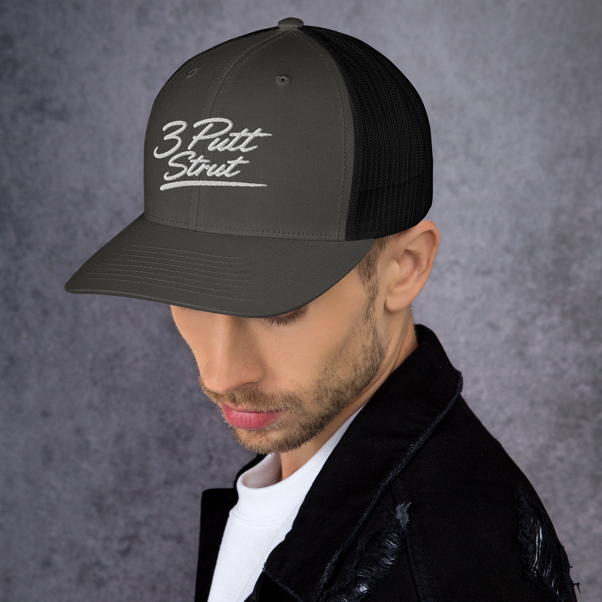 3 Putt Strut charcoal trucker hat, left side